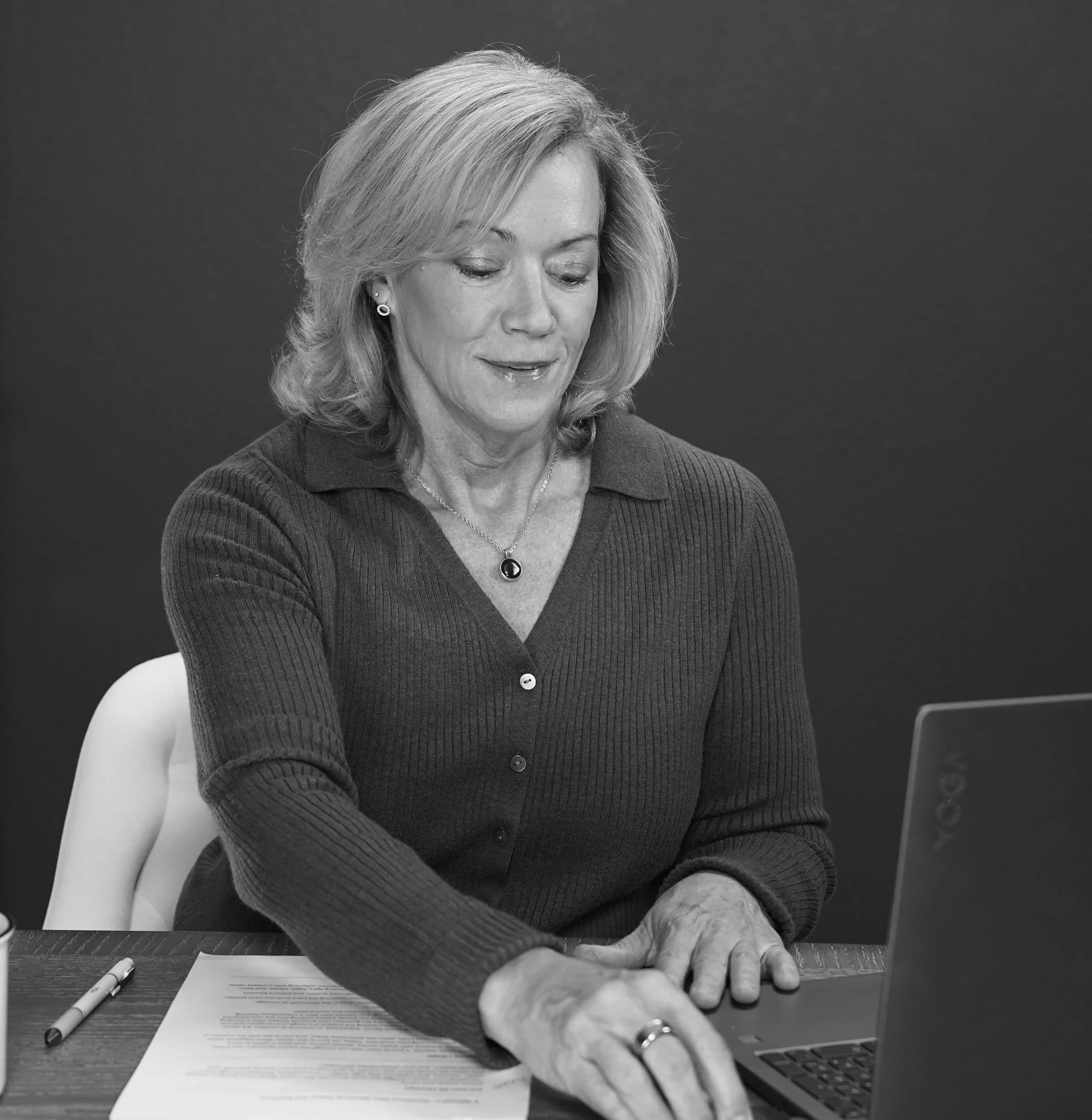 Joyce McHugh at her desk preparing a session